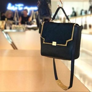 Kelly Wynne pop the champagne satchel